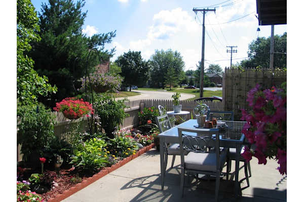 A table set for two with a view of a street.
